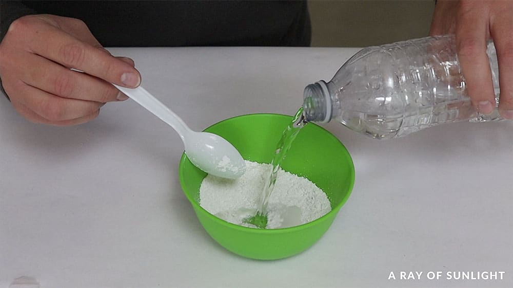 Mixing calcium carbonate with water to make chalk paint