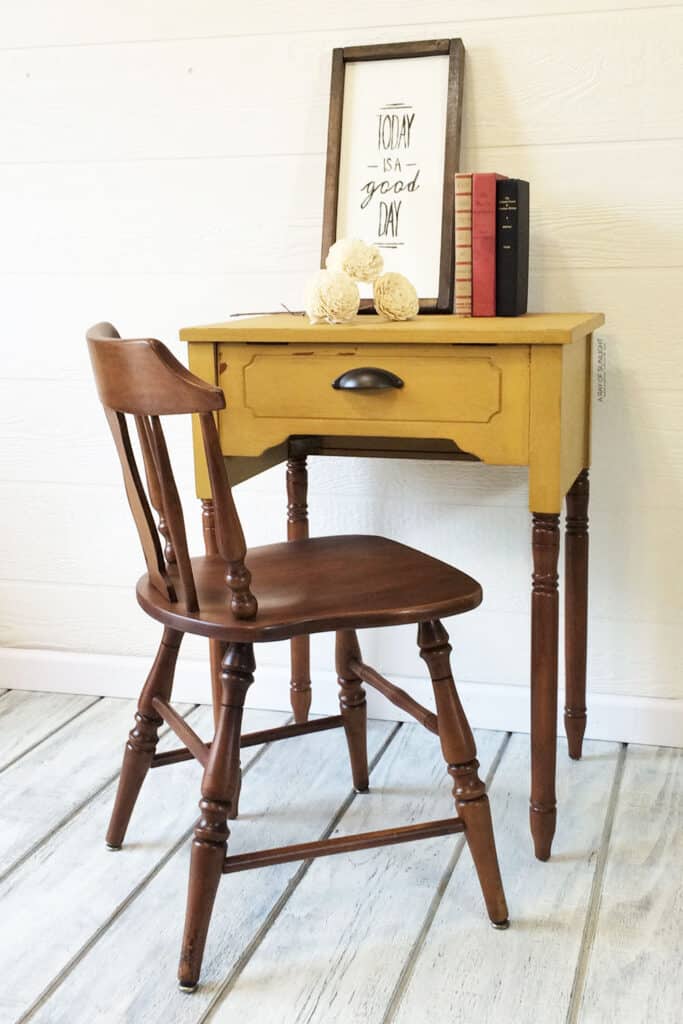mustard yellow sewing table with wooden chair - turns the sewing table into a youth desk