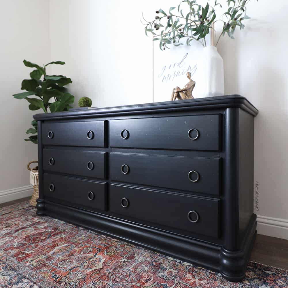 Black painted dresser with black drawer pulls.