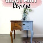 A side table shown half painted blue and half in original wood