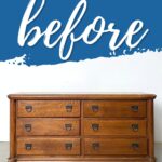 A wooden dresser with six drawers and black handles before makeover