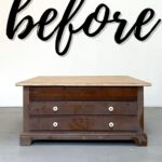 A worn brown coffee table before painting it black
