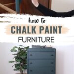 brushing green chalk paint on a dresser