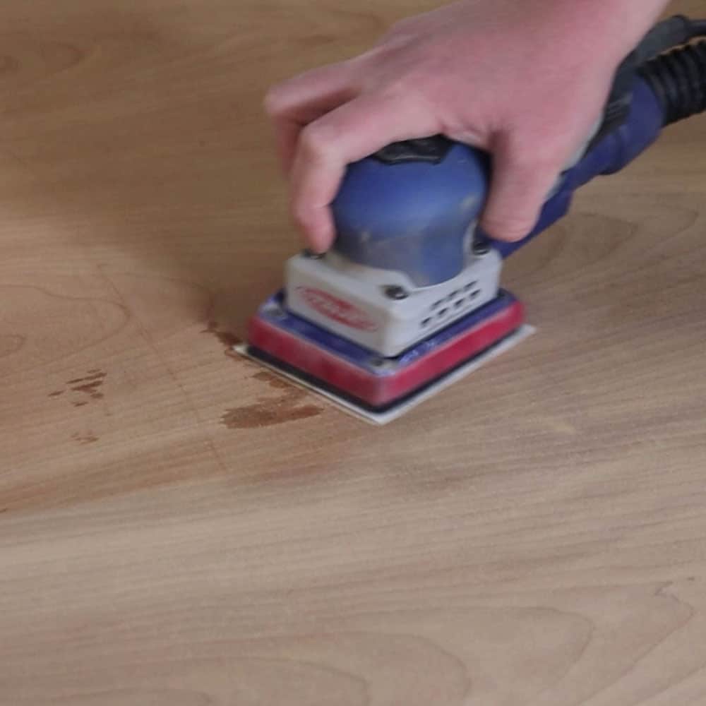 sanding the top to remove marks in the raw wood 