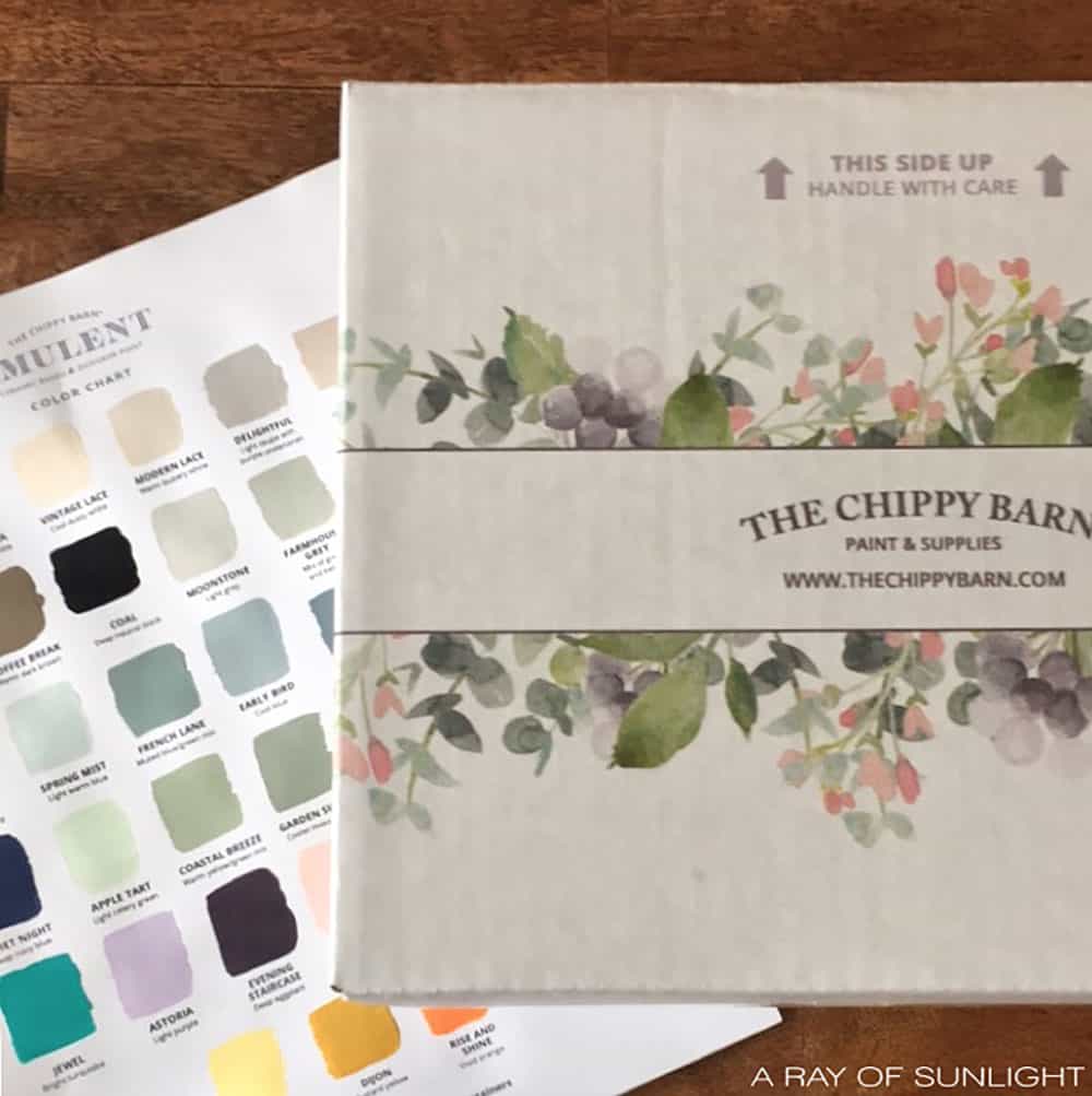 closeup of the chippy barn amulent paint packagine and paint color chart