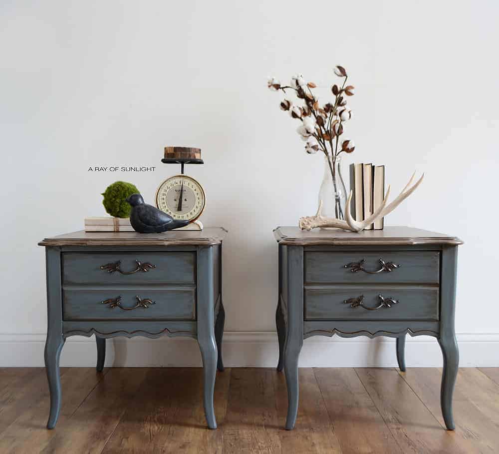full view of the old blue painted french provincial nightstands with farmhouse decorations