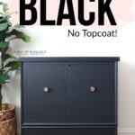 Black painted tall cedar with gold knobs
