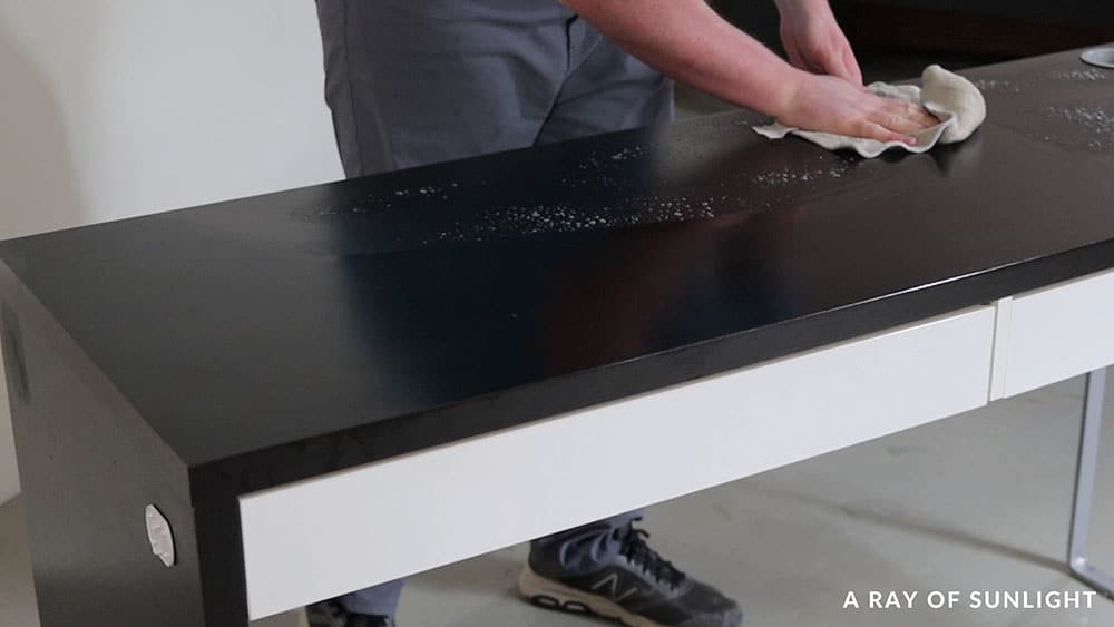 Cleaning an IKEA desk with Krud Kutter and a damp rag