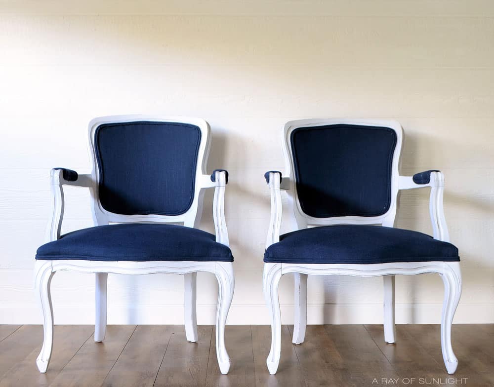 white painted french chairs with navy blue linen upholstery
