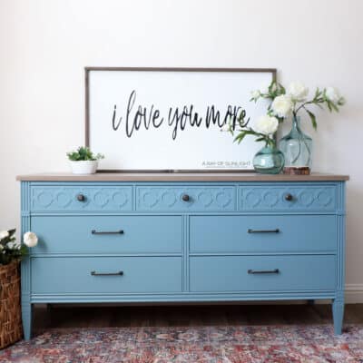 Light blue painted dresser with a brown weathered top
