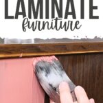 A hand paints brown laminate furniture with pink paint; text reads Best Paint for Laminate Furniture.