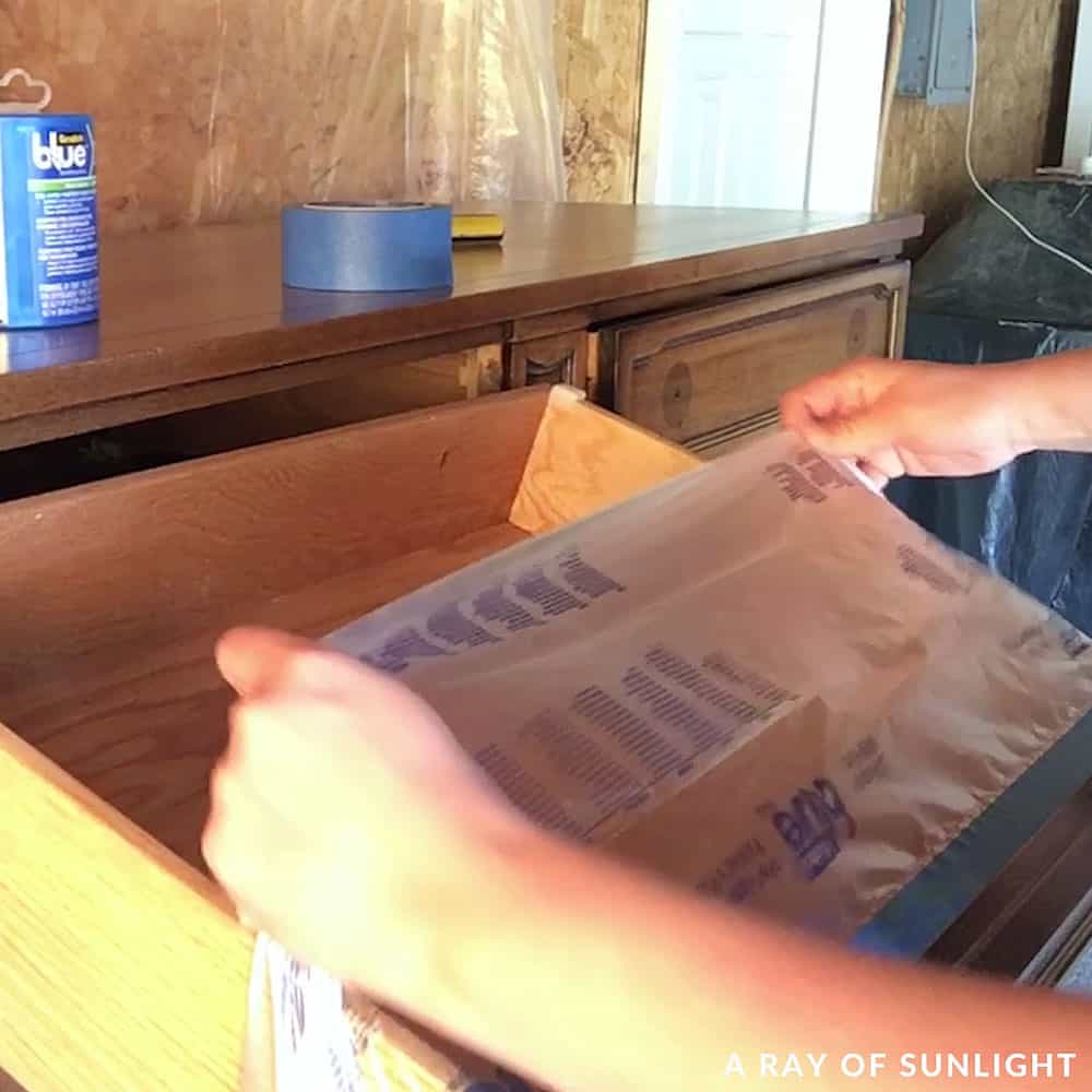 putting tape and pretaped plastic inside the drawers