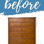 A wooden dresser with four drawers and brass handles