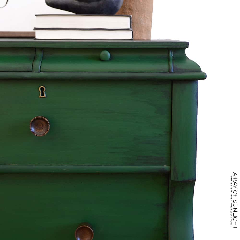 closeup of the DIY emerald green dresser painted with black glaze