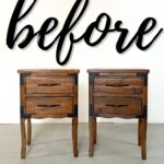 Two wooden nightstands with metal accents in front of a wall