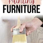 Hand holding a paintbrush applying topcoat to wooden furniture with text above reading Topcoats for Painting Furniture.