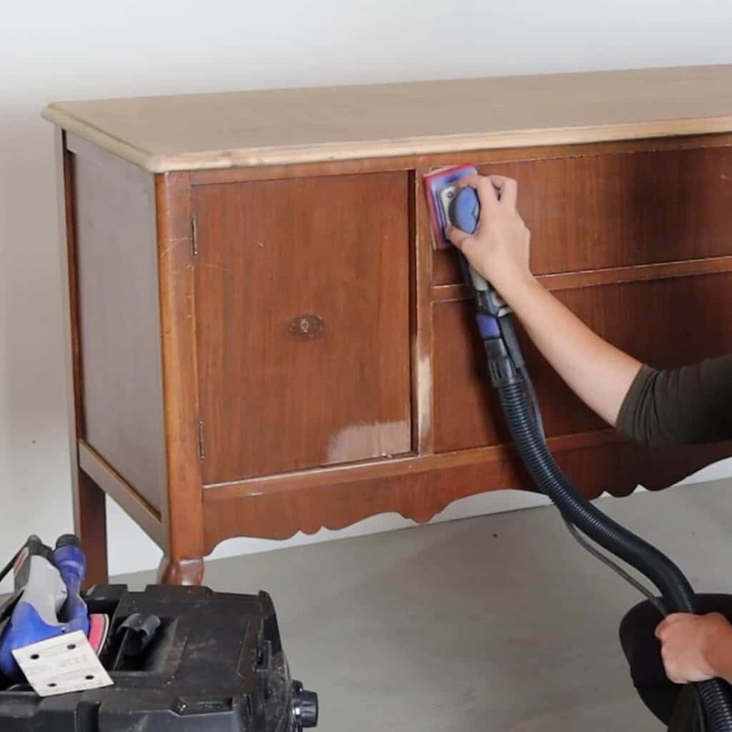 sanding furniture before painting with electric sander