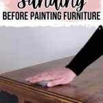 A hand sanding a wooden dresser with painted areas, with text about the importance of sanding before painting furniture.