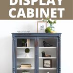 chippy blue painted display cabinet with white interior