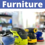 Four electric sanders for furniture are displayed on a white surface with shelves blurred in the background.