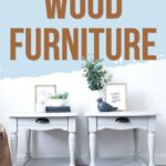 Two light gray painted end tables with black pulls
