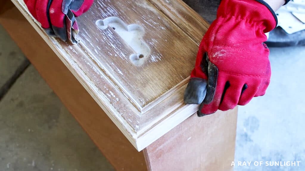using sanding grips to sand primer off the little groves of the drawer