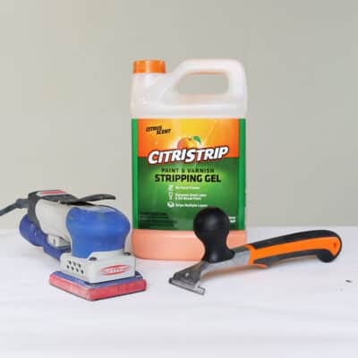 citristrip chemical stripper, carbide scraper and power sander are tools for removing paint from wood