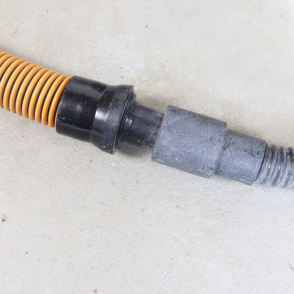 an adapter to connect sander hose to a shop vacuum
