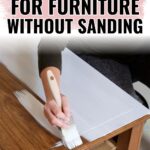 Person painting a wooden table white with a brush; text reads Best paint for furniture without sanding.