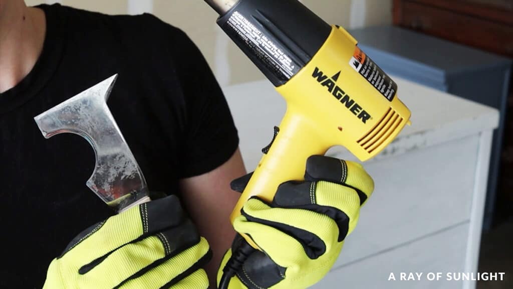 a heat gun and a putty knife for removing paint from wood