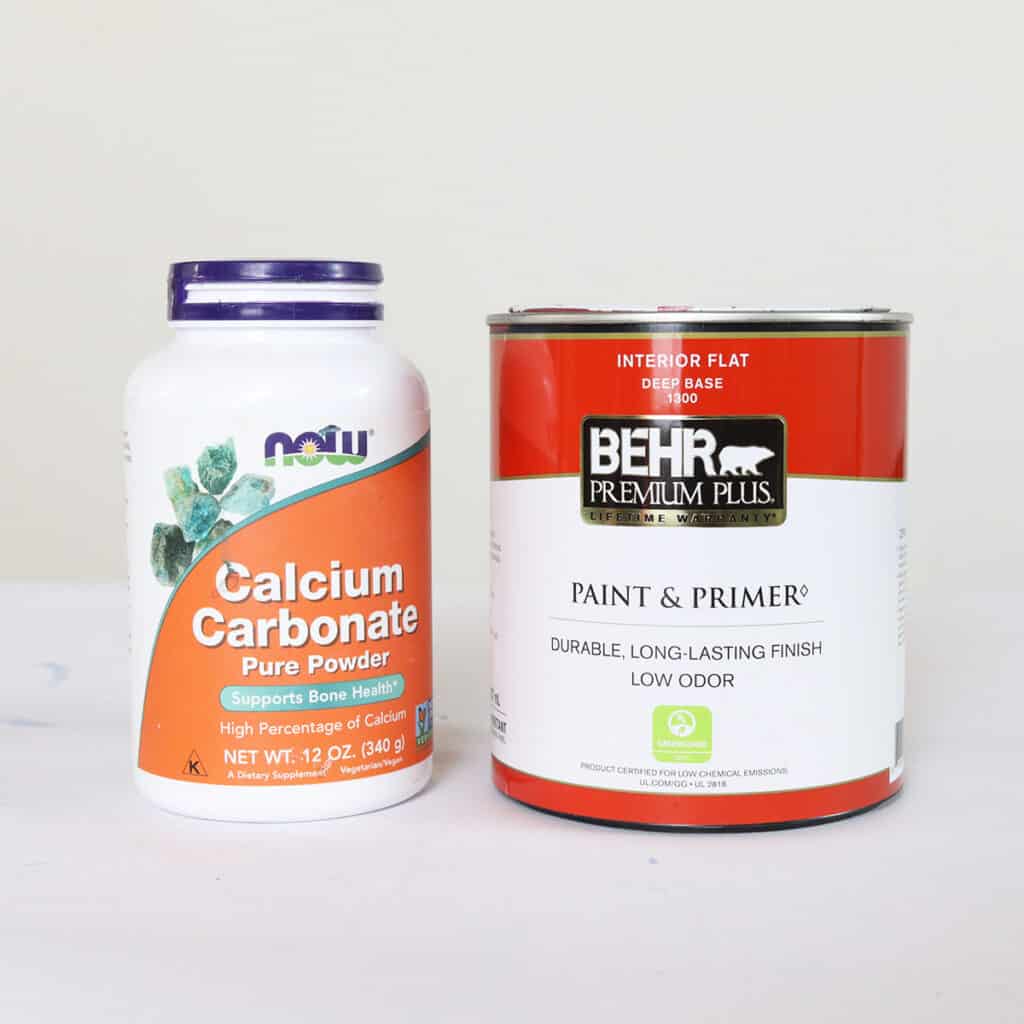 jar of calcium carbonate powder and can of behr latex paint