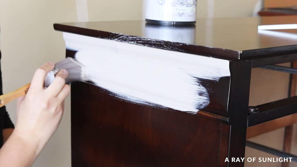 brushing heirloom traditions paint onto furniture
