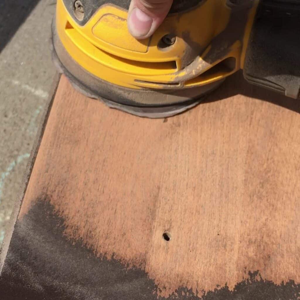 sanding the brown paint off