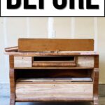 An old, unfinished wooden dresser sits in a garage