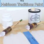 Two paint cans, brushes, and painted swatches labeled Fusion and Heirloom on a wooden surface.
