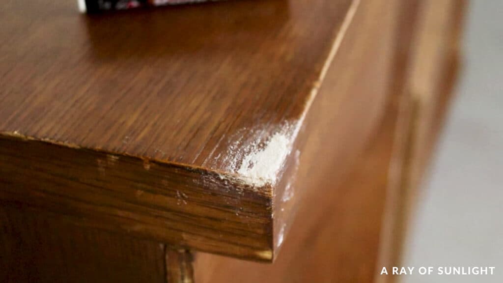 chipped veneer spot on dresser top filled with kwikwood