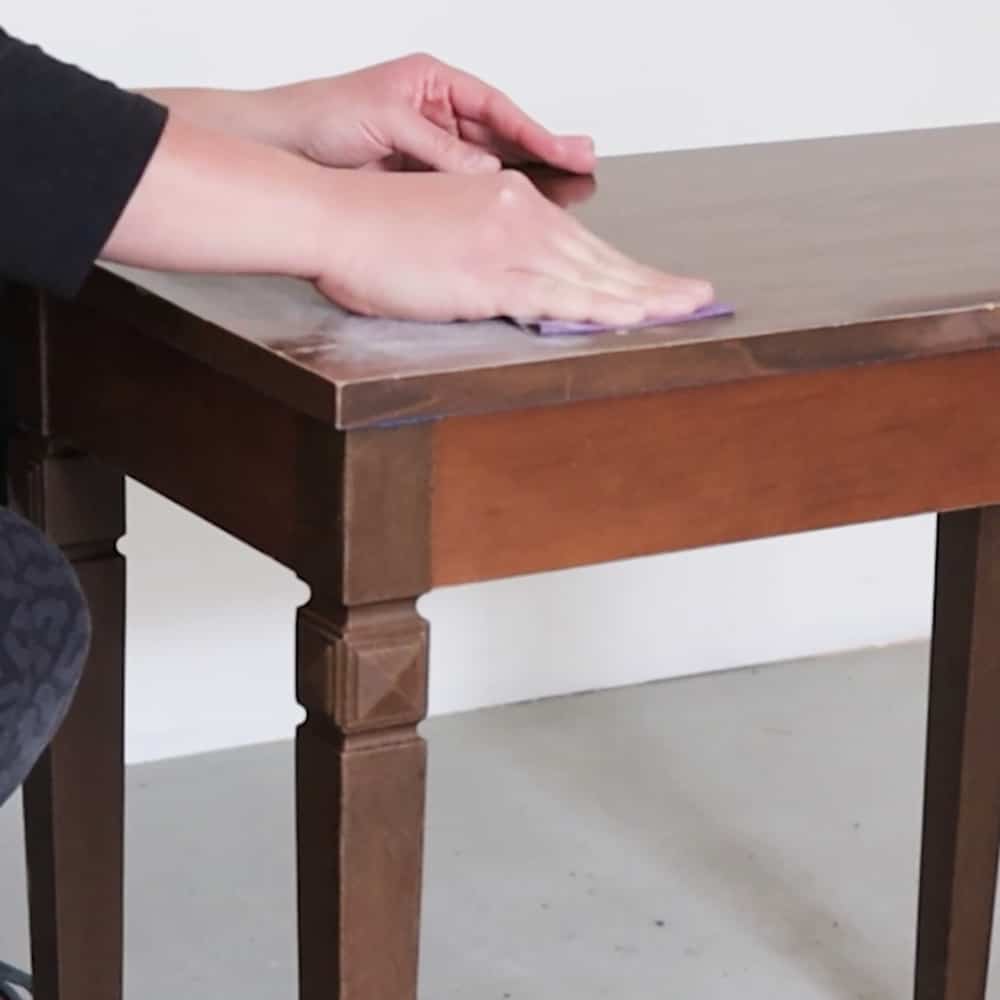 scuff sanding laminate wood surface with 220 grit sandpaper