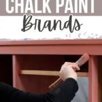 Hand painting a wooden furniture piece with pink chalk paint, text reads Top Chalk Paint Brands.
