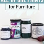 Four jars of all-in-one furniture paint with a paintbrush, labeled “Best All-In-One Paints for Furniture.”.