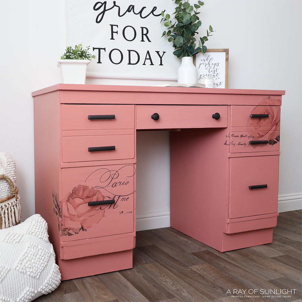 side angle of the laminate desk painted with pink chalk paint and with rose transfers