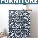 Dark navy dresser with white floral stencil pattern, surrounded by pillows; text reads Stenciling Furniture.