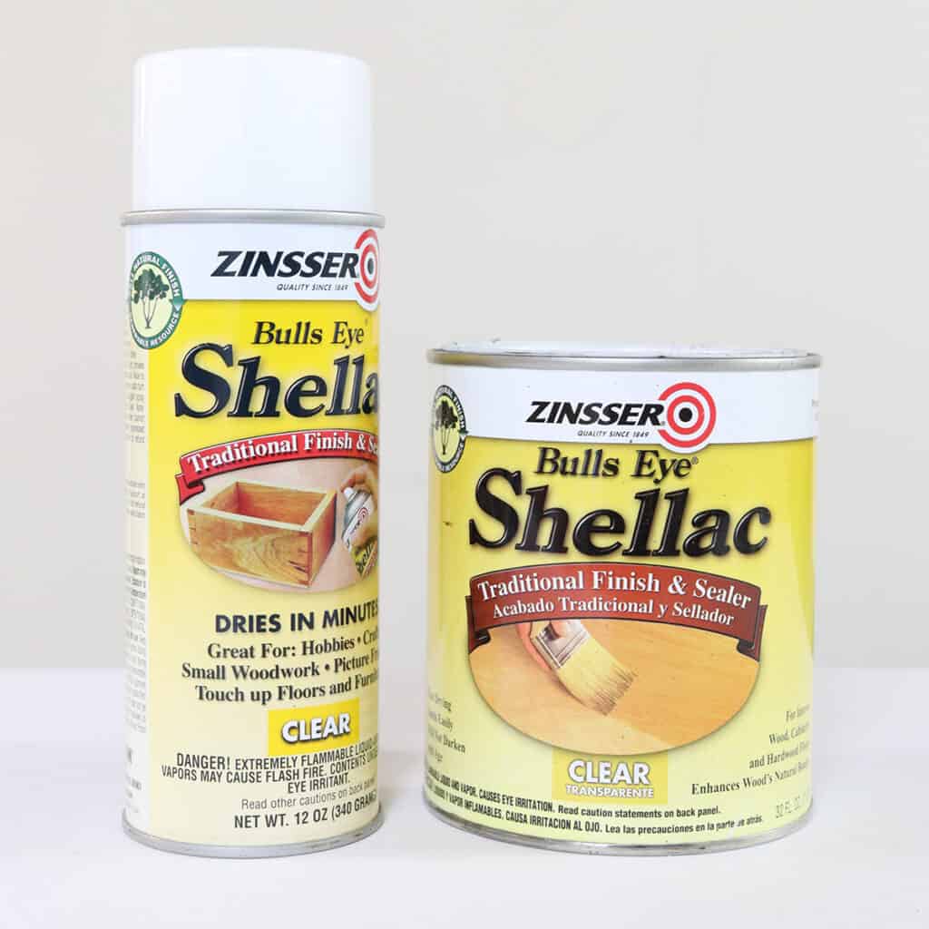 a can and spray can of zinsser clear shellac