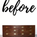 A dark wooden dresser with brass handles under the word before in large black script.