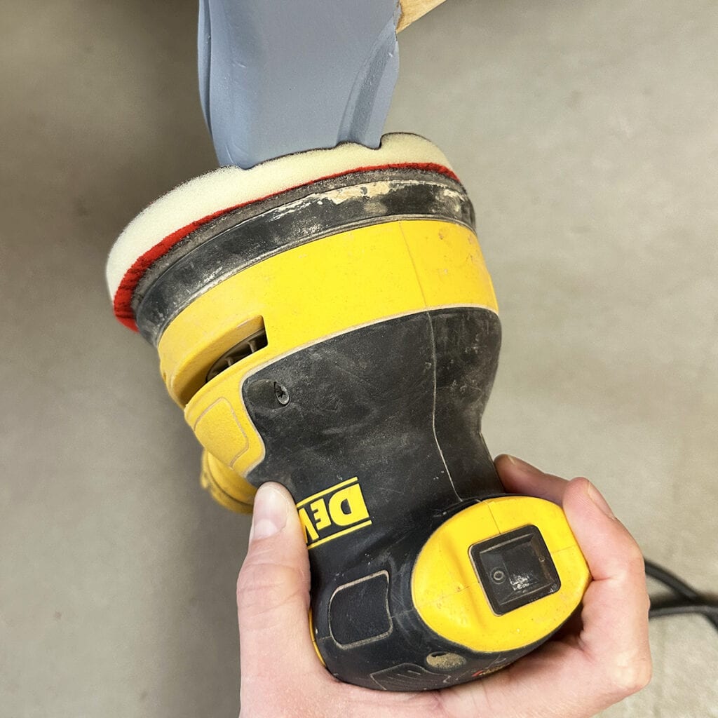 sanding furniture curves and details with orbital sander and foam pad
