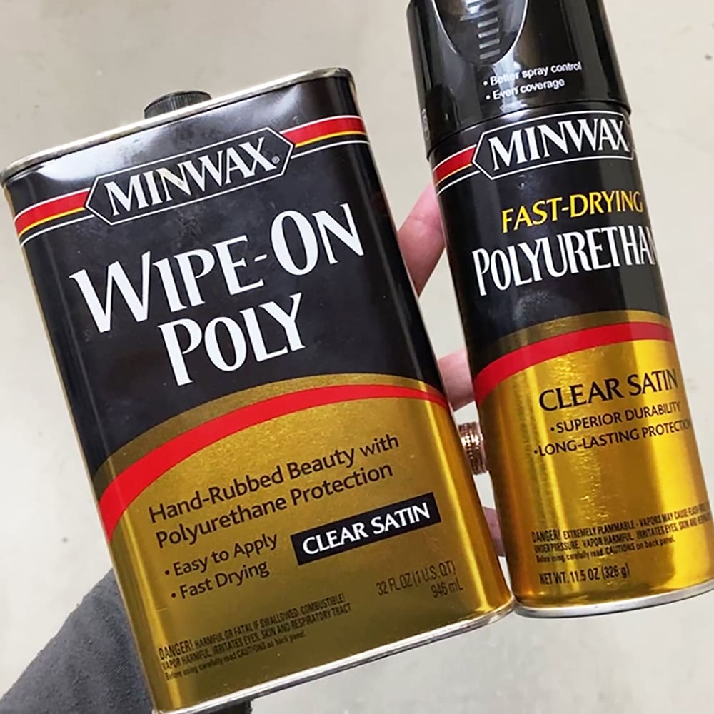 tin of minwax wipe on poly and spray can of minwax polyurethane