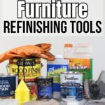 Various furniture refinishing tools and products, including stains, gloves, brushes, and cleaners on a white surface.