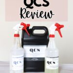 Three Stripwell QCS cleaning products: two spray bottles and one jug, with a Stripwell QCS Review sign above.