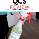 Person holding a bottle of Stripwell QCS cleaner; text above reads “STRIPWELL QCS REVIEW.”.