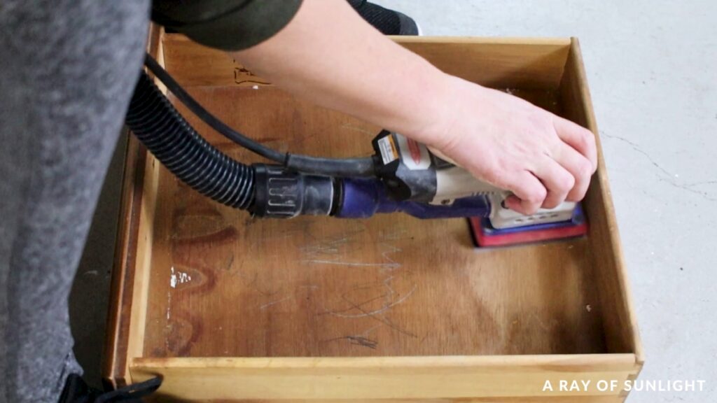 sanding the inside of a drawer