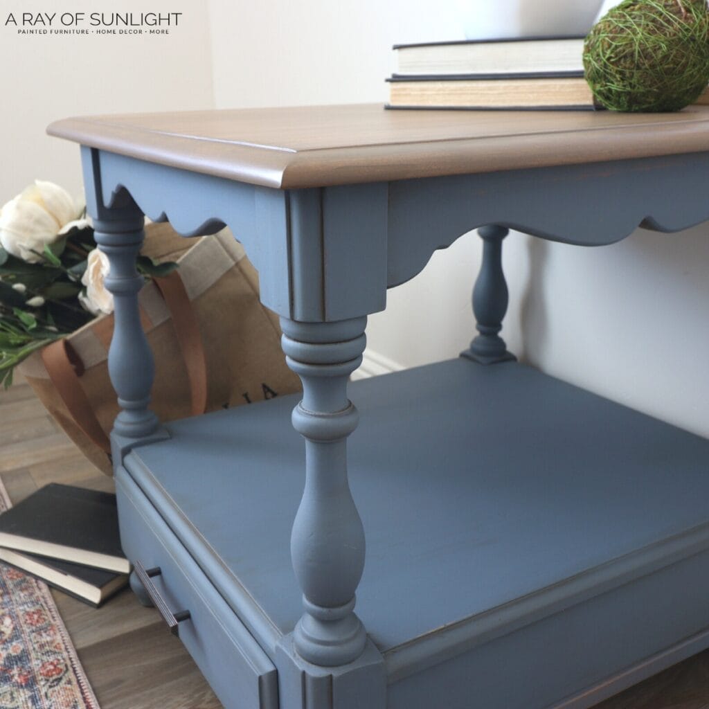 side view of blue painted french end table